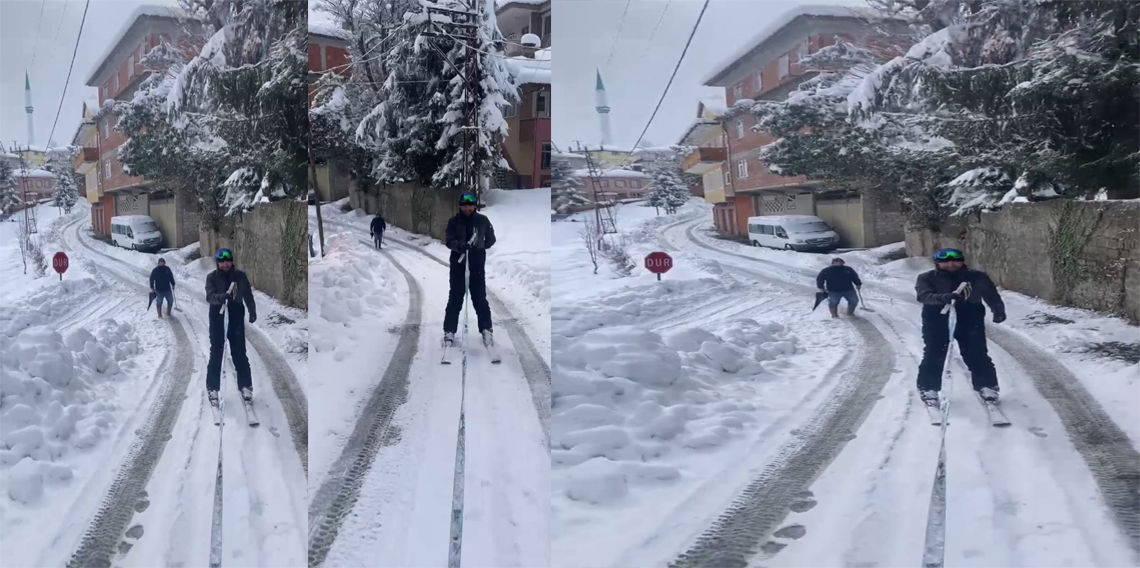 Pikabın arkasına bağladığı iple mahalle arasında kayak yaptı